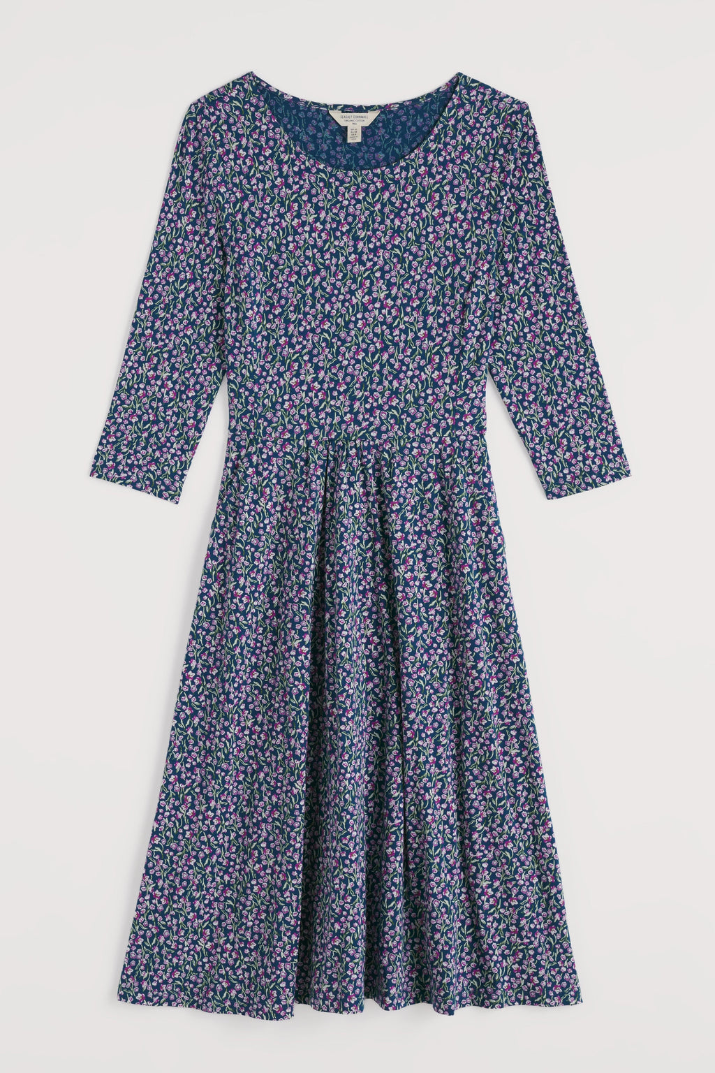 Floral organic cotton dress with long sleeves on a white background