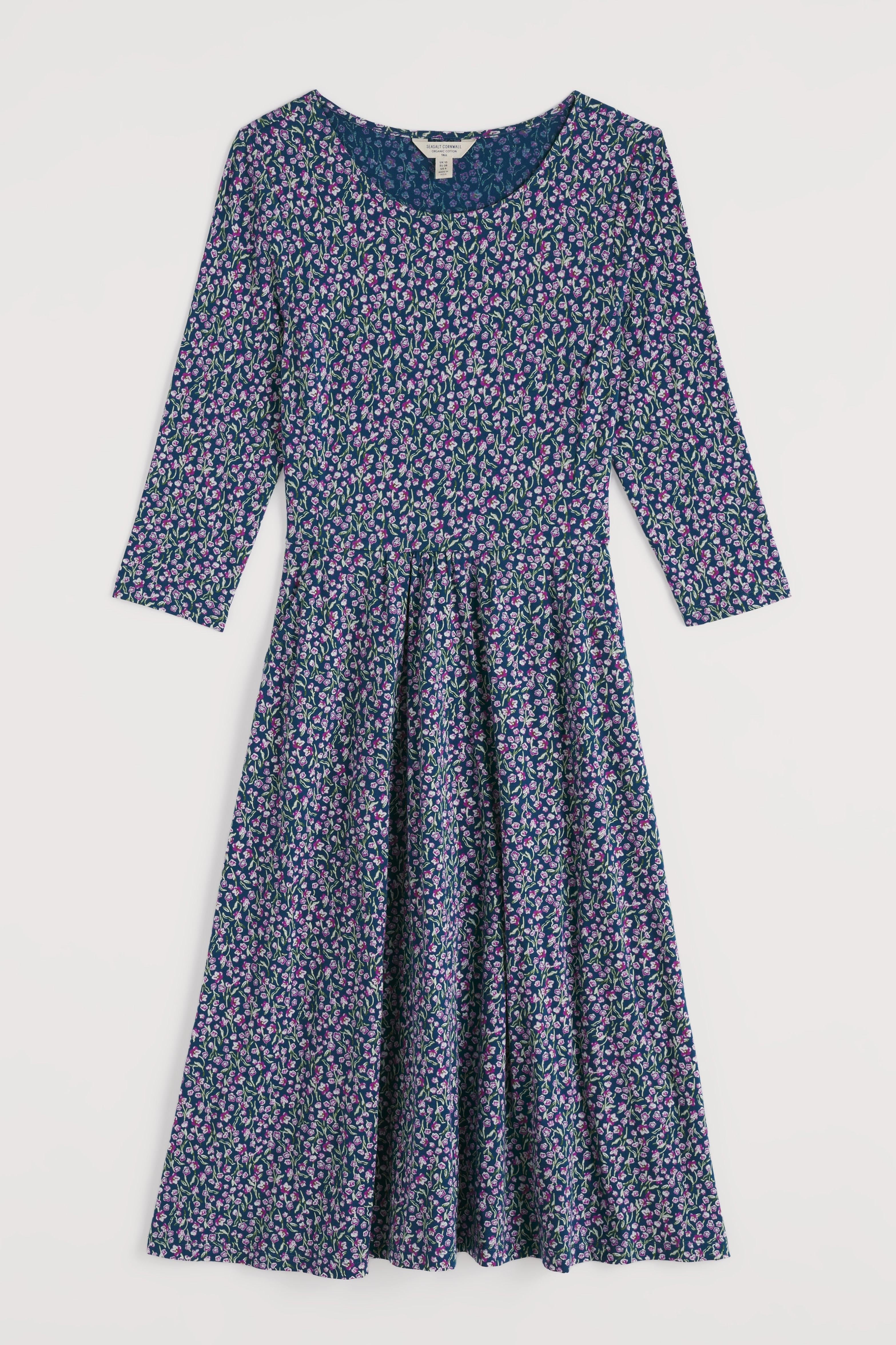 Floral organic cotton dress with long sleeves on a white background